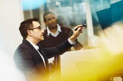 Two men working together in an office