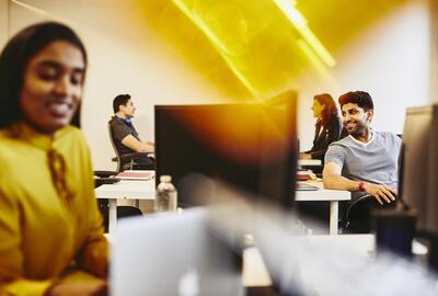 Men and women working in an office